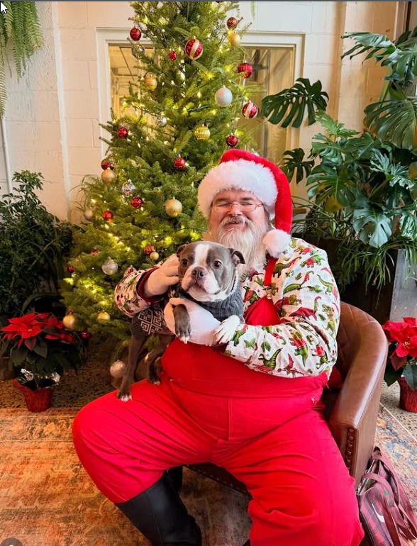 Santa greeting guests at a festive brewery gathering